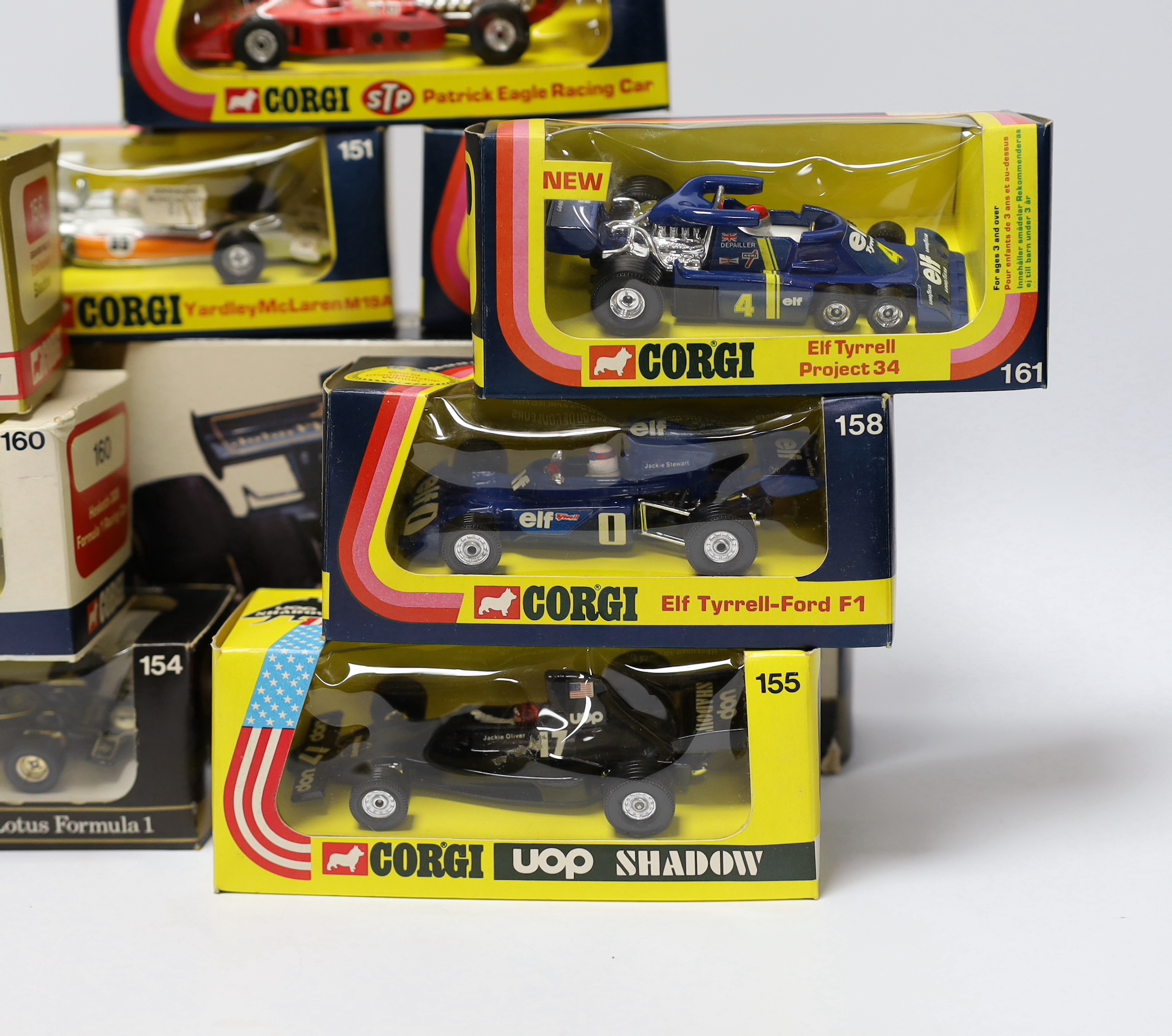 Ten boxed Corgi racing cars